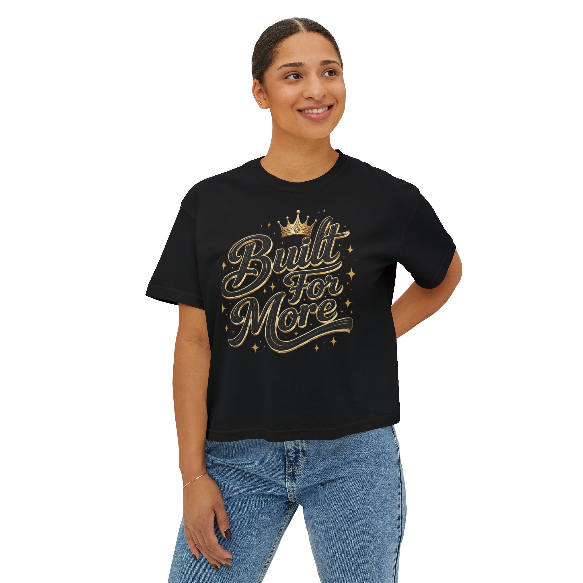 Person wearing a black t-shirt featuring the ELEV8 BY DESIGN "Built for More" graphic in gold